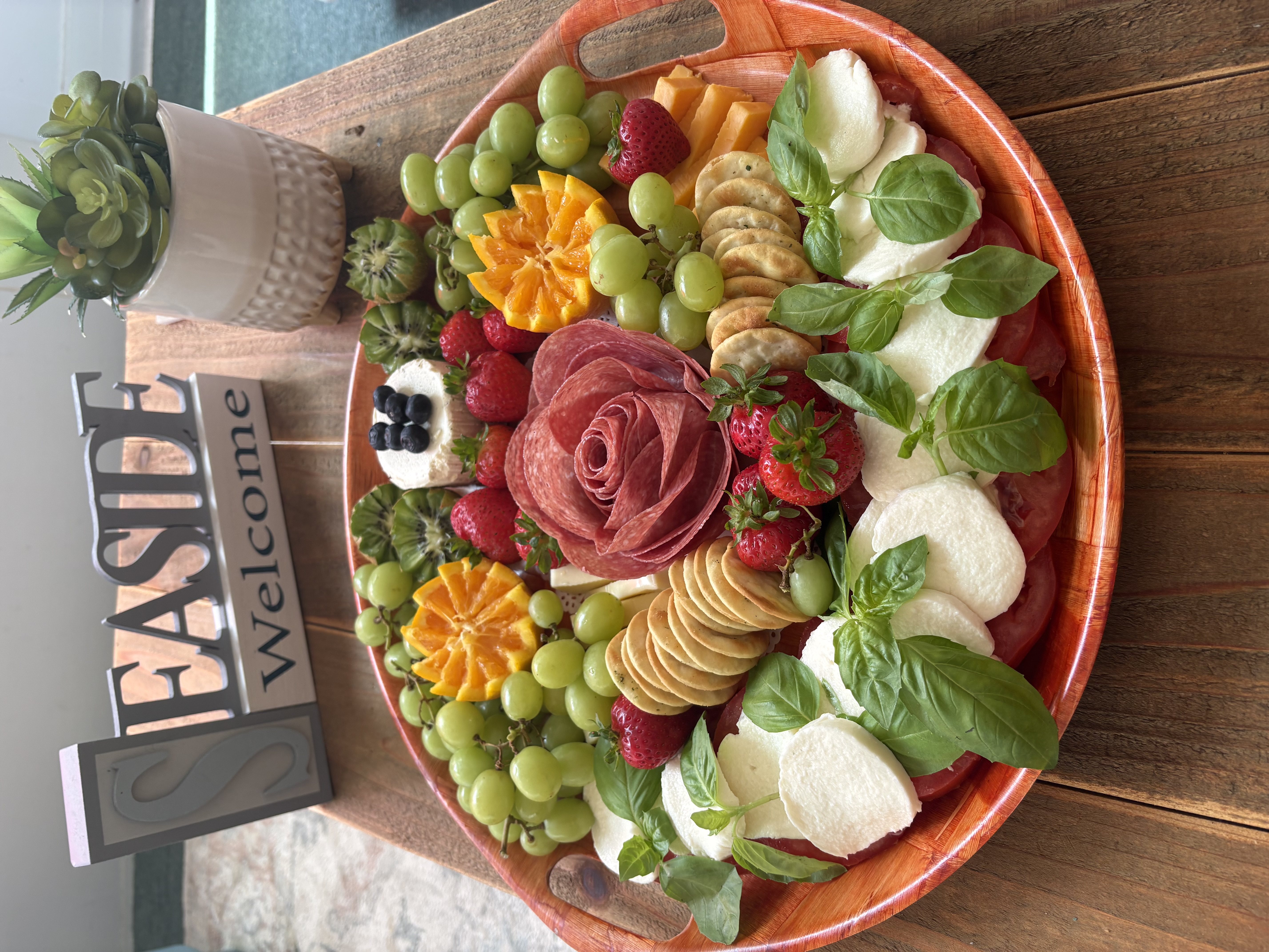 Hunt & Honey round board with salami rose, mozzarella, grapes, strawberries and fresh basil